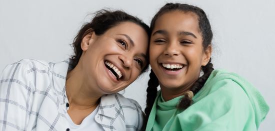 Mother and daughter embracing 