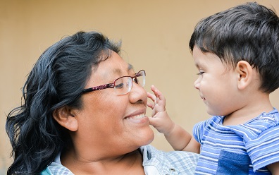 Woman holding boy toddler.