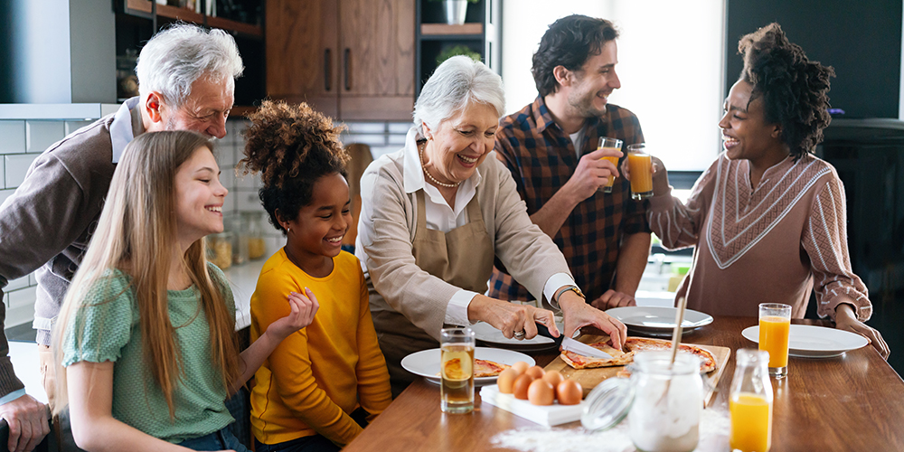 Family and friends sharing a meal together at a table