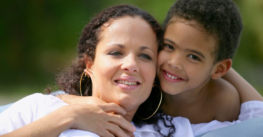 Little boy hugging mom.