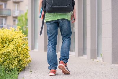 Youth walking down the street. 