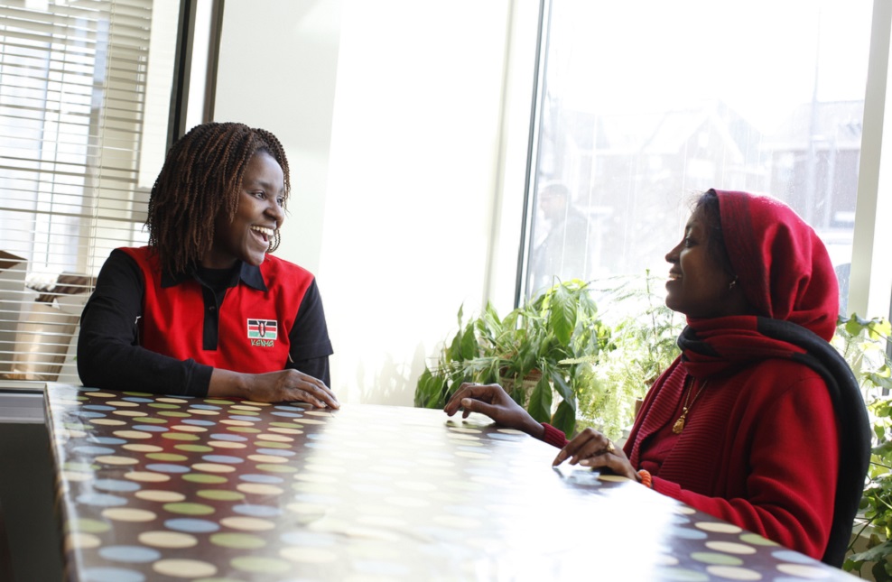 Refugees discussing at a table