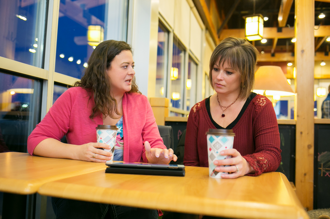 Image of a woman receiving financial counseling. 