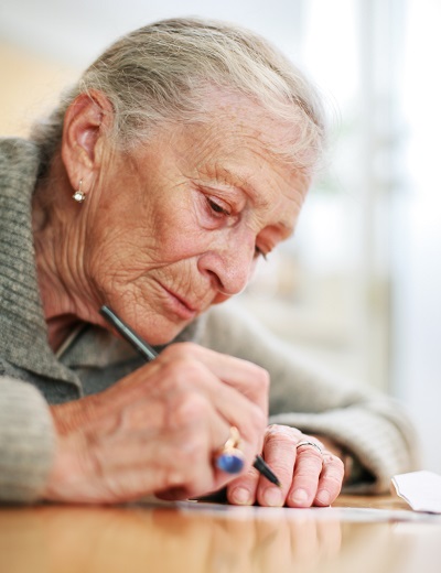 Woman writing.