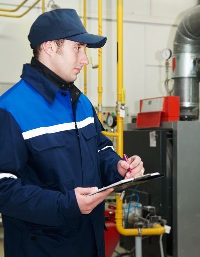 Worker inspecting housing