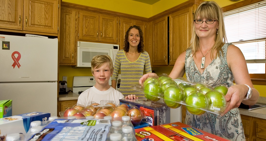 Family gathering food and water to donate