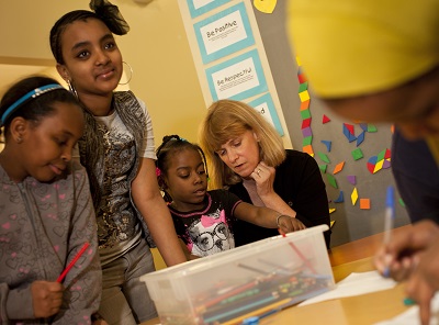 Jodi Harpstead reading to kids