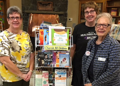 Women with books for children