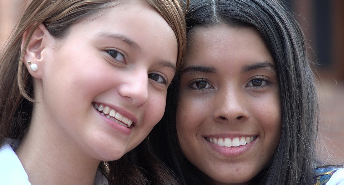 two girls smiling