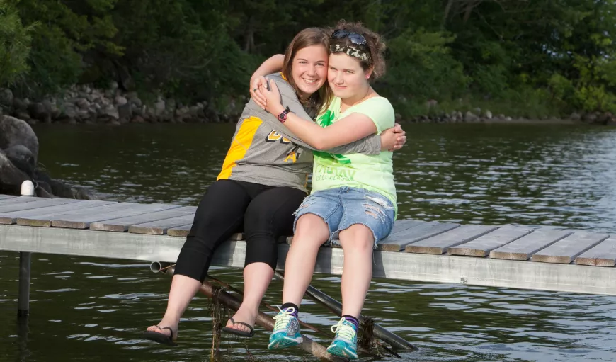 Sitting on a dock.