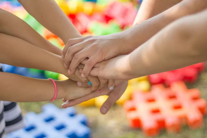 A group of hands gathered together