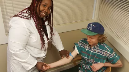 Medical professional helping a patient. 