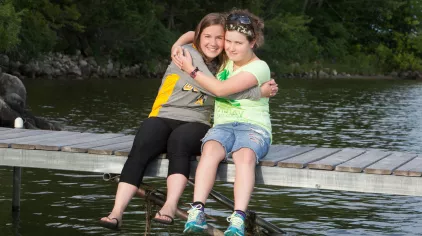 Sitting on a dock.