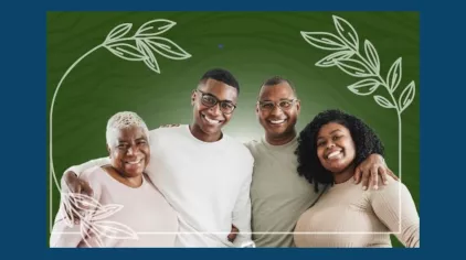 Four black individuals, two younger and two older, with their arms around each other and smiling for the camera.