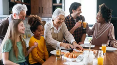 Family gathered around kitchen island